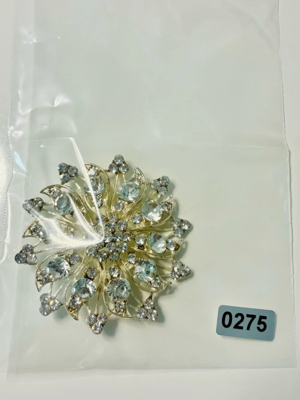 Crystal Floral Burst Brooch - Light Blue Rhinestone Accent